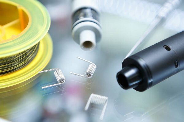 Vape shop.Modern vaping development service & upgrade parts in close up.Buy ualr ecig vaper device.Ic gadget for smoking ejuice.Box mod & wire
