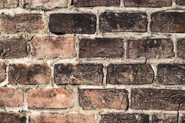 Arka plan aşınmış eski kırmızı tuğla duvar. Kirli sarı tuğla doku. Duvar zemin.