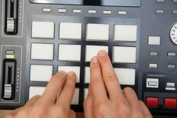 Overhead shot of sound recording equipment for beat maker.Hip hop music producer produces beat on push button production controller.Dj play new beat live on pad media production center device