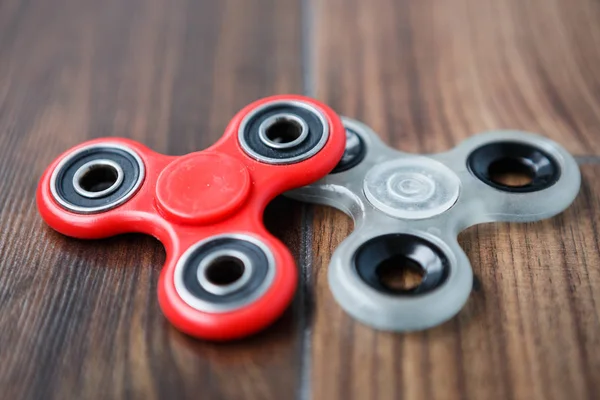 Popular finger spinner device.Modern fidget spinning toy on bearings.Spin it in hands & learn cool new tricks.Have fun with this new rotating gadget.