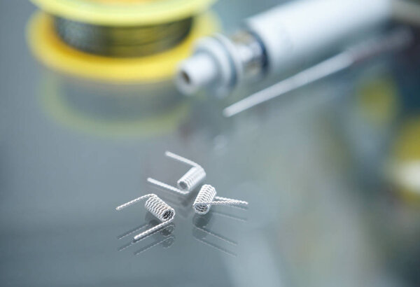 Vape shop.Modern vaping development service & upgrade parts in close up.Buy ualr ecig vaper device.Ic gadget for smoking ejuice.Box mod & wire
