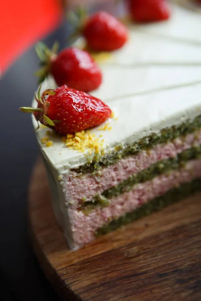 delicious sweet Italian cake with pistachio & strawberry biscuit decorated with fresh strawberries in syrup.