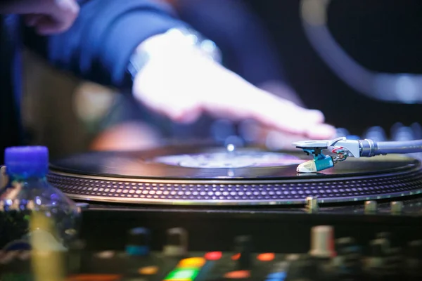 MOSCOW - 15 NOVEMBER,2016: Professional DJ digital turntable.Play music in the club on Technics player.focus on turntables needle.Disc jockey scratch records on stage