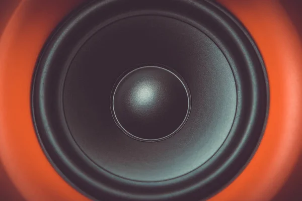 Hifi red loud speaker box in close up.Professional audio equipment for dj,musician.High quality sound recording studio equip.Focus on hi-fi diffusor speaker built in plastic cabinet box