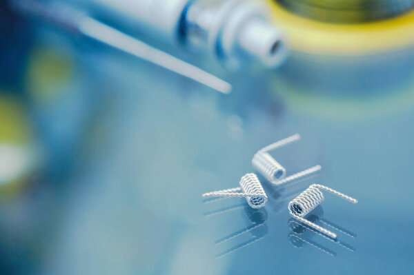 Vape shop.Modern vaping development service & upgrade parts in close up.Buy ualr ecig vaper device.Ic gadget for smoking ejuice.Box mod & wire
