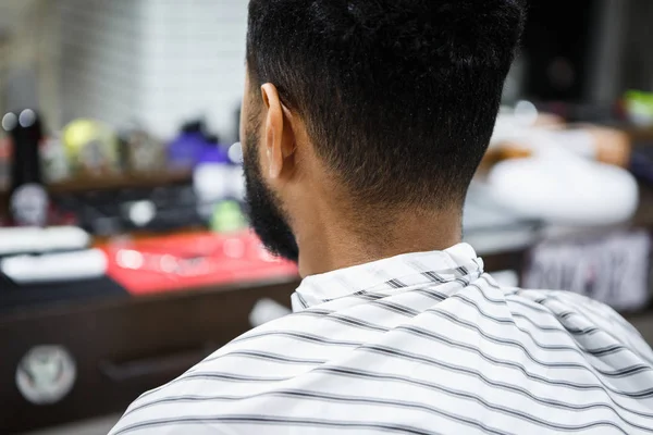 Young Black Man Sitting Barber Shop Covered Blanket Shot Back — Stock Photo, Image