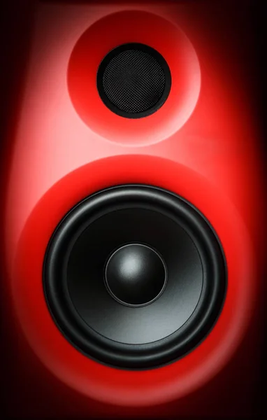 Hifi red loud speaker box in close up.Professional audio equipment for dj,musician.High quality sound recording studio equip.Focus on hi-fi diffusor speaker built in plastic cabinet box