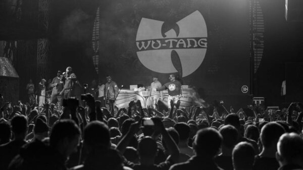 MOSCOW - 13 NOVEMBER, 2015:  Popular American hip hop band Wu-Tang Clan performing live in night club. Famous rap singer on stage. Black & white shot of celebrity rapper