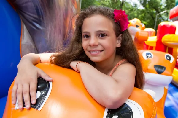 Cute Little Schoolgirl Playing Bouncing Castle Outdoors Bright Summer Day — Stock Photo, Image