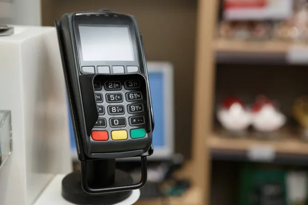 Credit card terminal at the checkout.Pay with cards or wireless mobile smart phone NFC payment technology.
