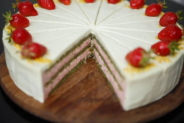 delicious sweet Italian cake with pistachio & strawberry biscuit decorated with fresh strawberries in syrup.