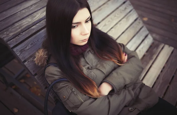 Sad Young Hipster Girl Grey Parka Coat Sitting Bench Serious — Stock Photo, Image
