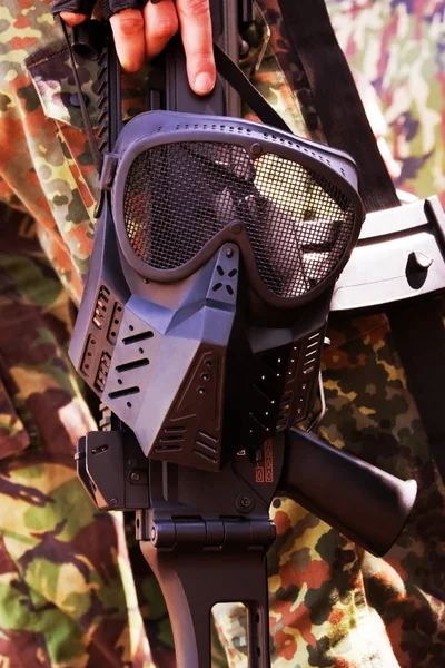 Black Military Mask Hanging Rifle — Stock Photo, Image
