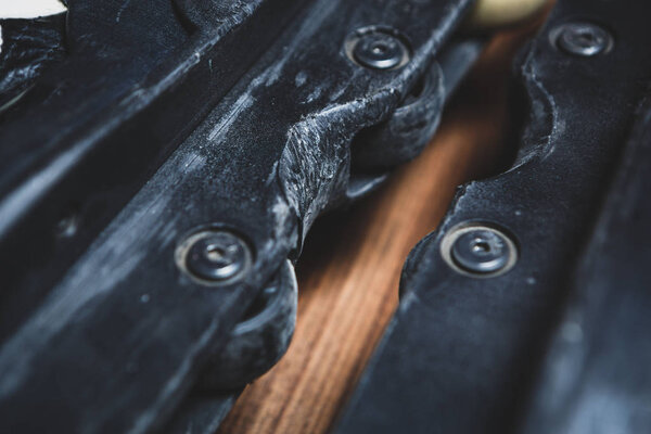 Frames of heavy used aggressive inline skate.Grind block with deep scrathes on roller blades for extreme skating.Grind rails, ledges and ramps on this skate model