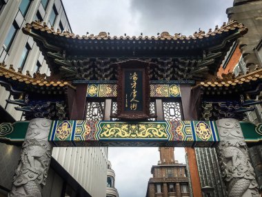 HAGUE,NETHERLANDS-25 APRIL,2018: Ancient Chinese gates in the city street of Den Haag in Holland. clipart