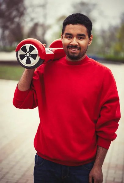 Joven Chico Africano Negro Con Moderno Mini Segway Eléctrico Rojo — Foto de Stock