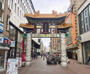 HAGUE,NETHERLANDS-25 APRIL,2018: Ancient Chinese gates in the city street of Den Haag in Holland. clipart