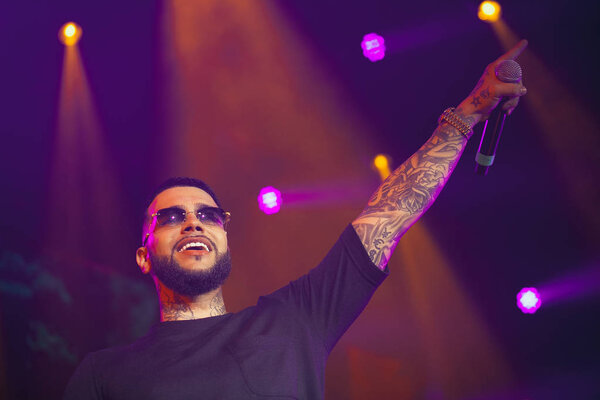 MOSCOW - 29 MAY, 2015: Big concert of popular Russian hip hop singers L'One & Timati in nightclub. Famous rapper performing live music set on stage in the club.Performing arts event