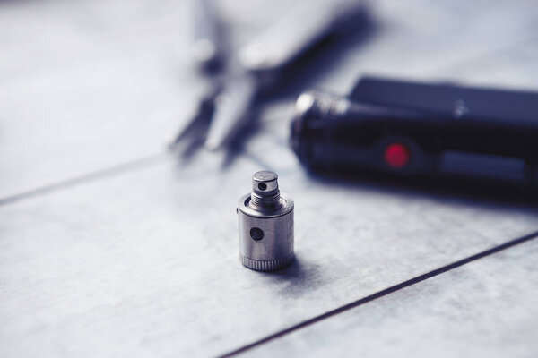 Repair, maintenance vaping device mod.Upgrade parts for modern vaporizer e-cig device, spare parts.Micro coil clearomizer.Quit smoking nicotine cigarette, start vaping safe ecig vape
