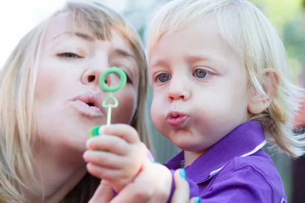 Little Boy Playing His Mother Playground Blowing Bubbles Togethers — Stock Photo, Image