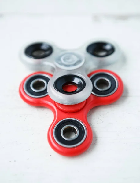 Popular finger spinner device.Modern fidget spinning toy on bearings.Spin it in hands & learn cool new tricks.Have fun with this new rotating gadget.