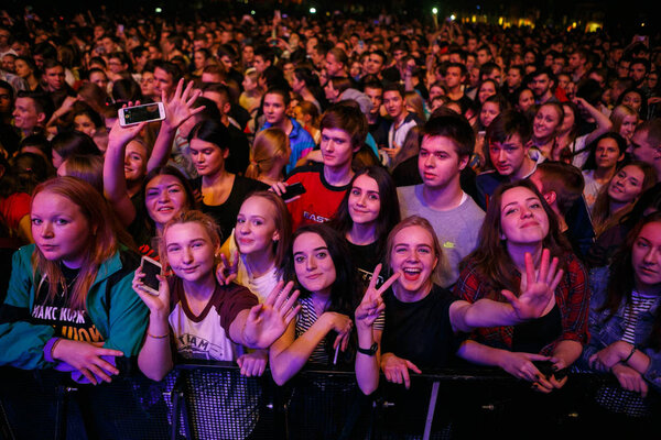 MOSCOW - 4 NOVEMBER,2016: Crowded dance floor in nightclub.Big live music show in night club.People have fun on concert.Huge crowd on festival.Fans wave hand to favorite singer sing popular song