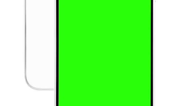 アプリケーションのロゴとテキストを配置する緑色のクロマキー画面を持つ現代の無名の白いスマートフォンデバイスの映像 スタジオの背景に隔離された未知の携帯電話のクローズアップビデオ — ストック動画