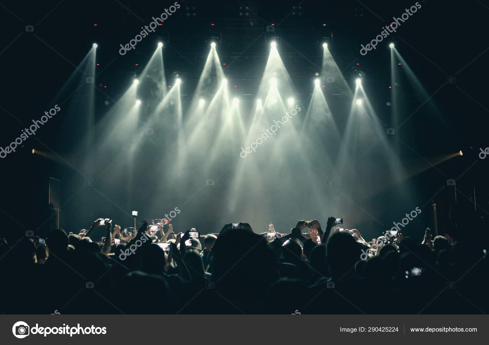 Concert stage lights and crowd on dance floor partying to the music Stock  Photo by ©hurricanehank 290425224