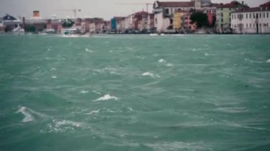 Venetian lagoon water in storm.Rainy day in Venice.Bad weather for cruise in Italian city Venezia.