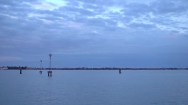 Beautiful Grand Canal of Venice at blue hour in spring.Dramatic cloudy sky at dusk.Footage of wide open space with no people & no boats.