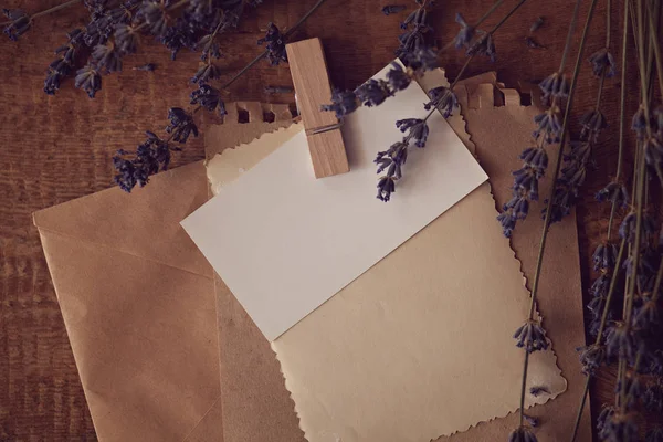 Vintage letter on wooden background with lavender flowers