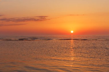 Baltic sea - early morning sunrise over the sea. clipart