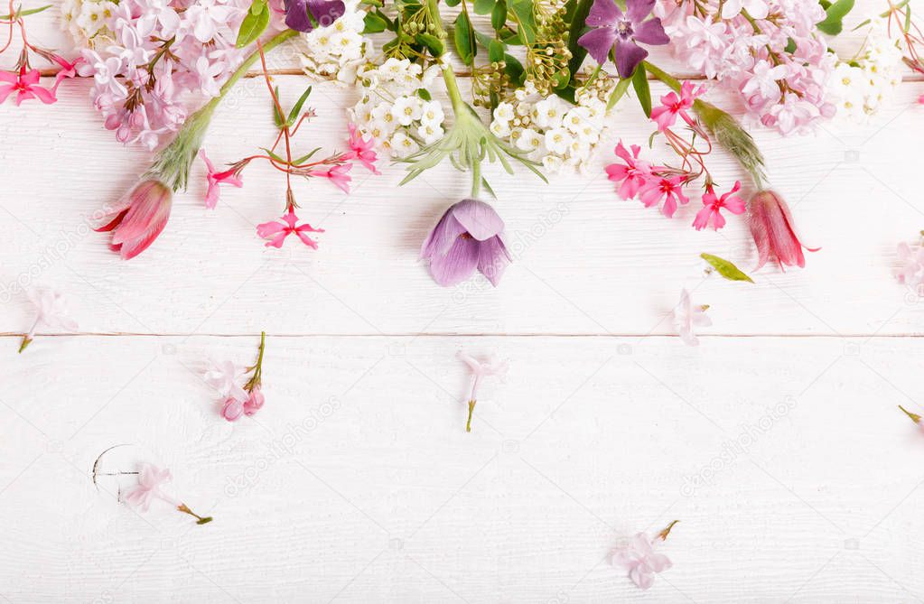 Festive flower composition on the white wooden background. Overhead view