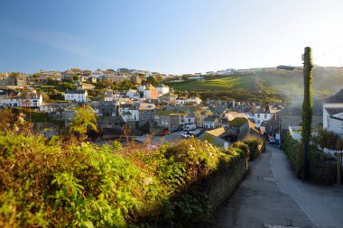 Port Isaac, a small and picturesque fishing village on the Atlantic coast of north Cornwall, England, United Kingdom, famous as backdrop to various television productions, on sunny autumn morning. clipart