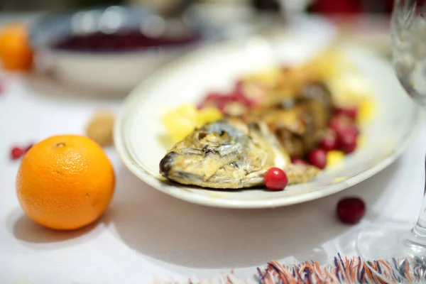 Traditional Christmas Eve dinner in Lithuania, held on the twenty fourth of December. The meal is a family occasion which includes many traditions of both pagan and Christian origin.