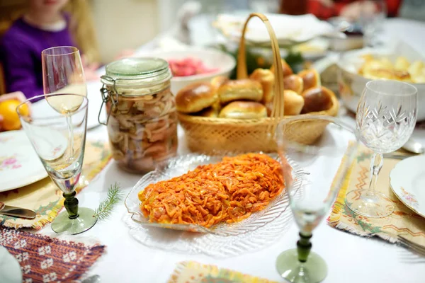 Traditional Christmas Eve dinner in Lithuania, held on the twenty fourth of December. The meal is a family occasion which includes many traditions of both pagan and Christian origin.