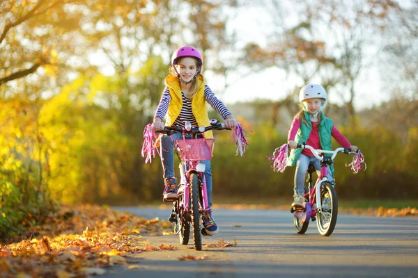 Cute Little Sisters Riding Bikes City Park Sunny Autumn Day — Stock Photo, Image