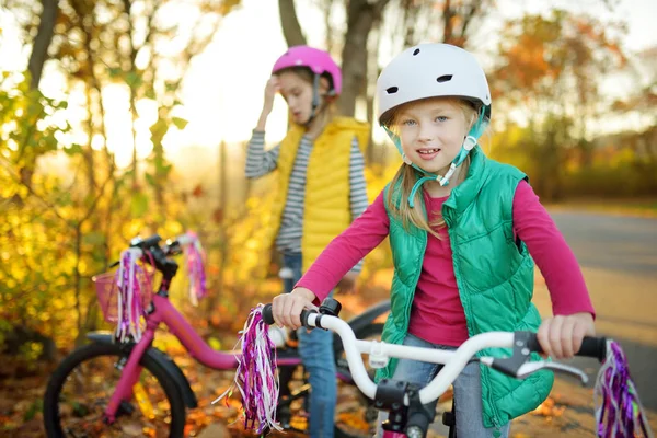 Cute Little Sisters Riding Bikes City Park Sunny Autumn Day — Stock Photo, Image