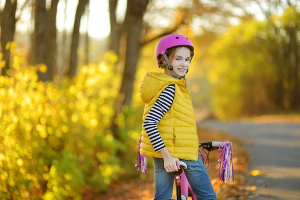 Cute Little Girl Riding Bike City Park Sunny Autumn Day — Stock Photo, Image