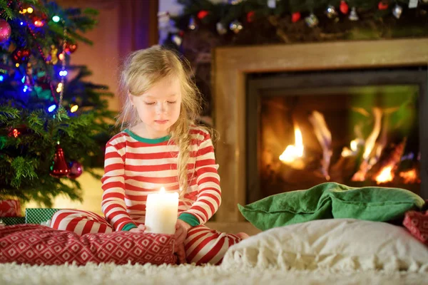 Happy Little Girl Wearing Christmas Pajamas Playing Fireplace Cozy Dark — Stock Photo, Image