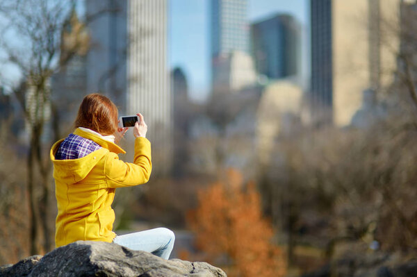 Happy young woman tourist taking selfie at Manhattan, New York City