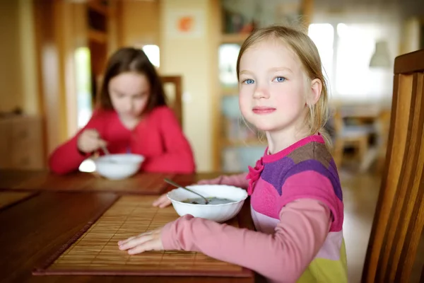 Two Cute Little Sisters Eating Soup Cozy Dining Room — Stock Photo, Image