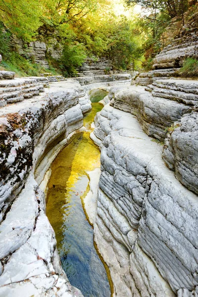 Papingo Rock Pools, also called ovires, natural green water pools located in small smooth-walled gorge near the village of Papingo in Zagori region, Greece.