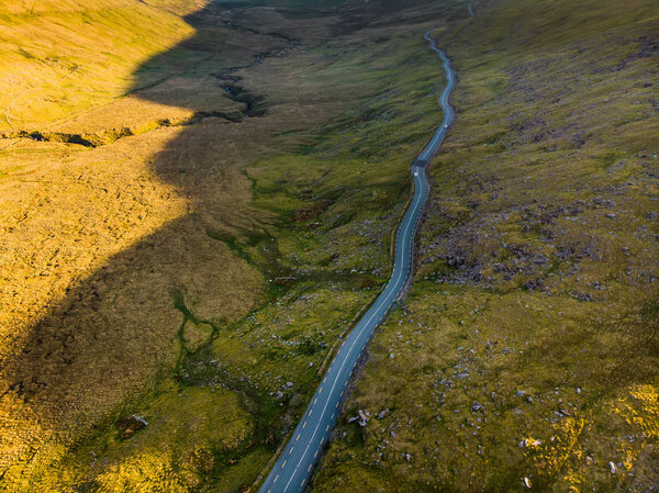Aerial view of Conor Pass, one of the highest Irish mountain passes served by an asphalted road, located on the Dingle Peninsula, County Kerry, Ireland