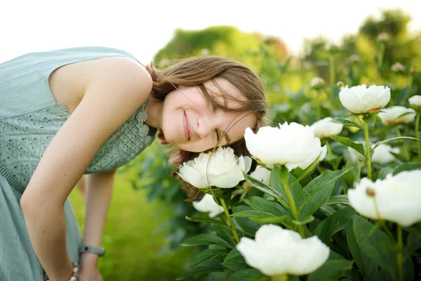 Cute Young Girl Admiring Tall White Peonies Sunny Summer Day — Stock Photo, Image