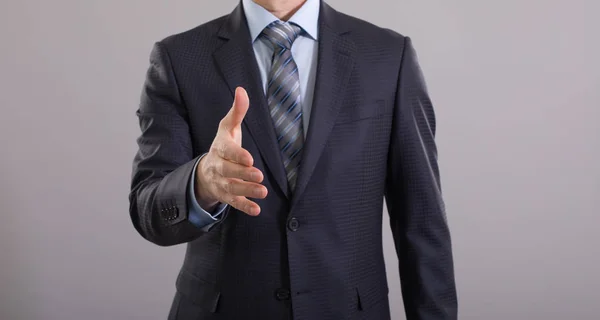 Businessman Reaches Out Handshake — Stock Photo, Image