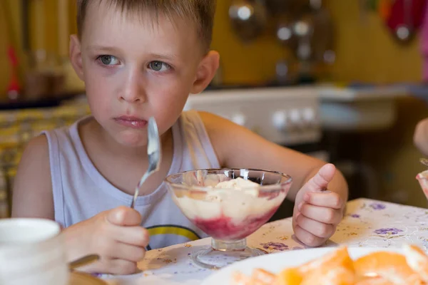 Sad Little Boy Eating Ice Cream Bowl Sitting Table Kitchen — Stock Photo, Image