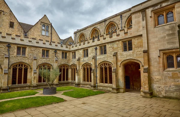 The view of the Cloister Garden of Christ Church with the olive tree in lead planter. Oxford University. England