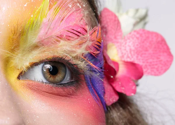 Woman with fashion feather eyelashes make-up