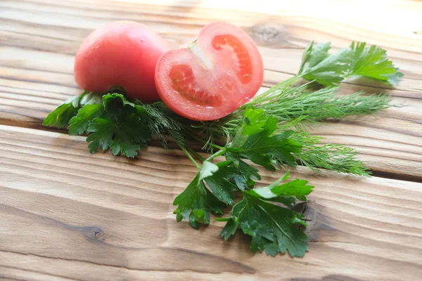 Tomatoes and greens — Stock Photo, Image